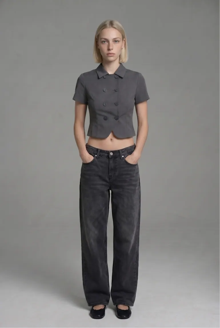 Model in grey blazer and jeans, front