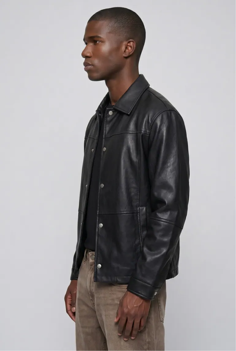 Male model in black leather jacket, side profile